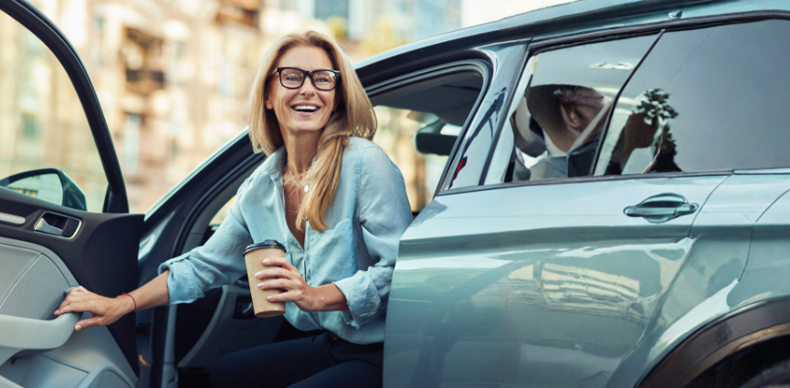 q4 beat your rate woman in car image